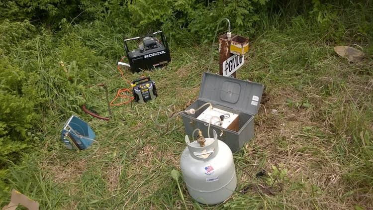 Sampling equipment in a grassy field