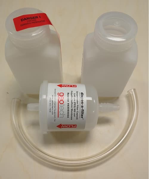 Water chemistry kit with two bottles, a filter, and tubing